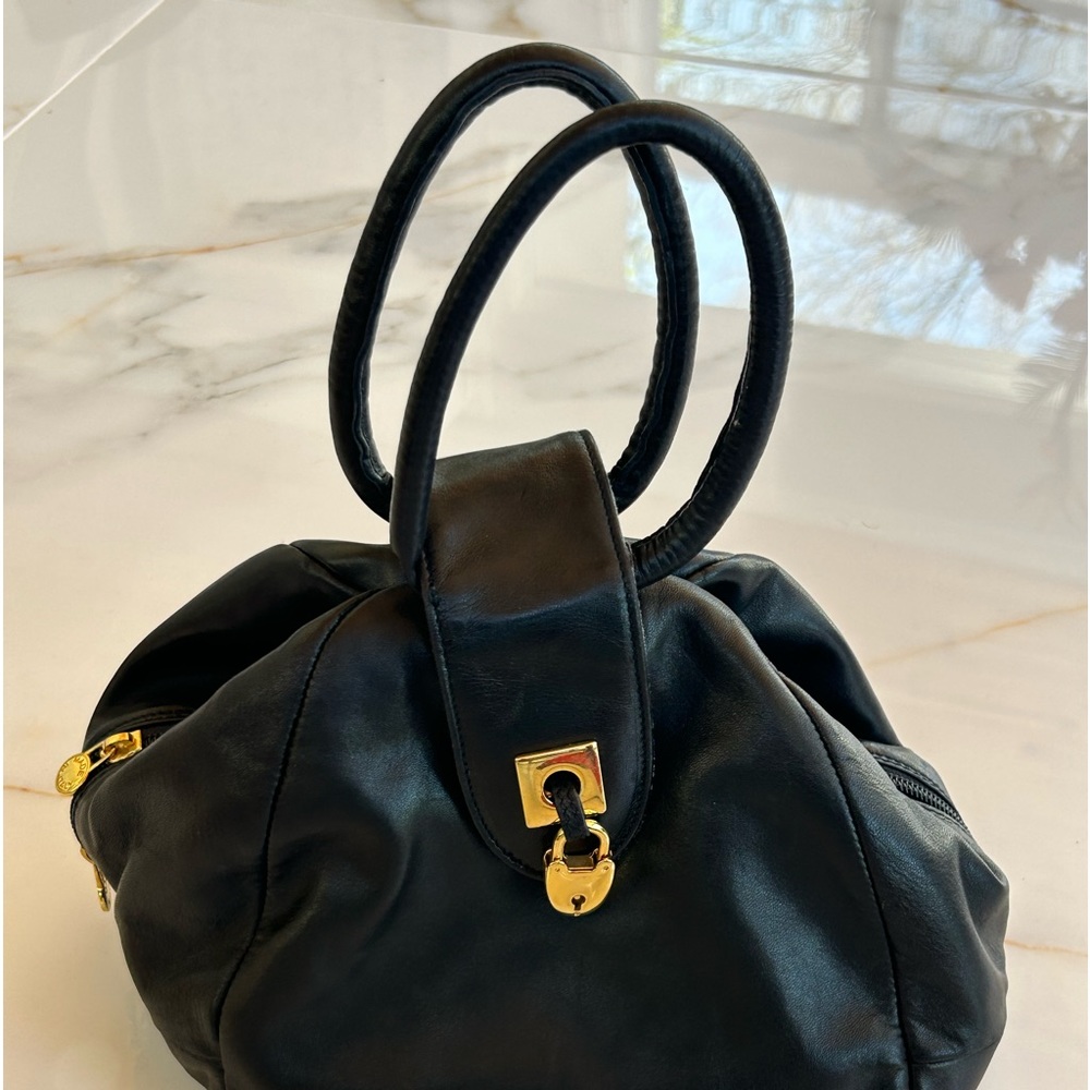 Carolina Herrera Stylish Black Hand bag with metal closing snap and hand straps